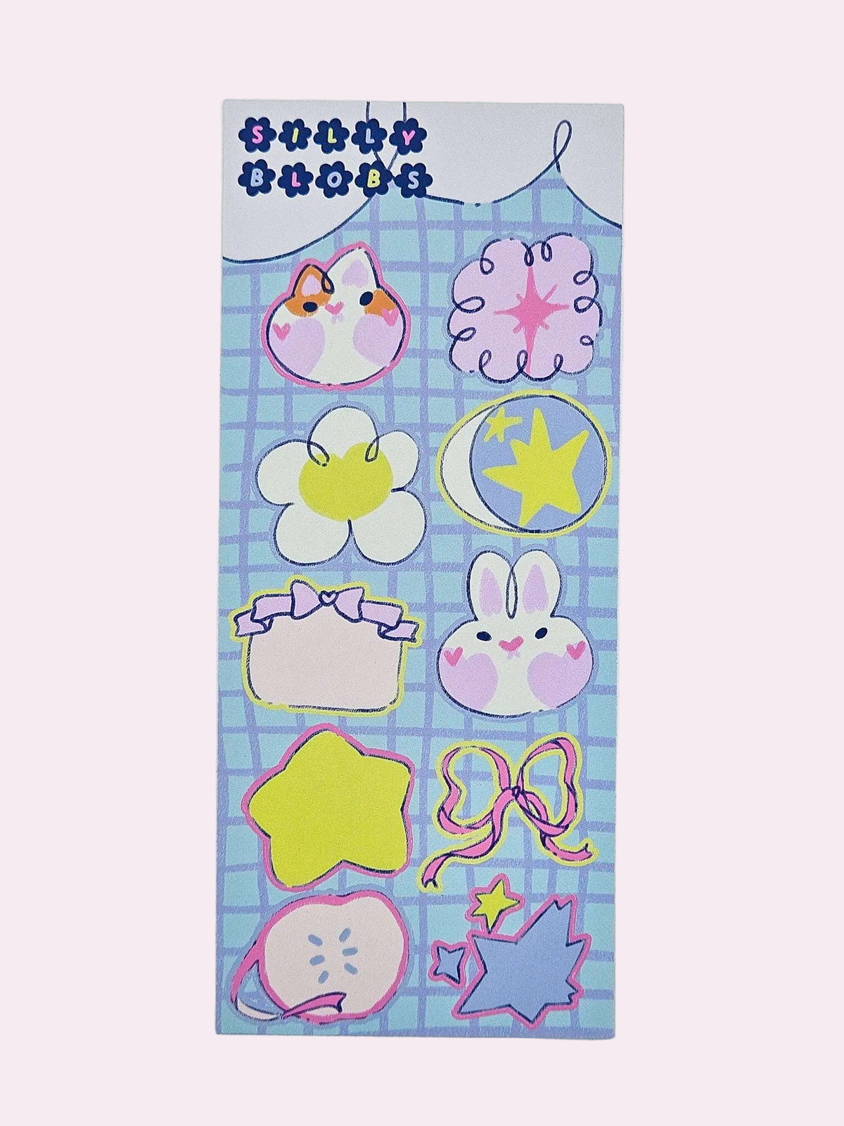 Silly Blobs blue variant sticker sheet featuring ten hand-drawn illustrated stickers including a corgi blob, sparkle blob, daisy blob, star blob, bunny blob, gift bow blob, yellow star blob, ribbon bow blob, apple blob, and shooting star blob on a blue grid background by Ailyse of Finding Wonderland