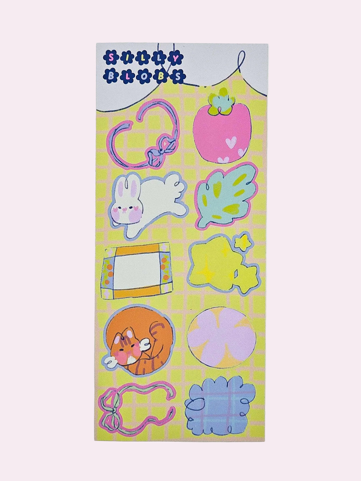 Silly Blobs yellow variant sticker sheet featuring ten hand-drawn illustrated stickers including a heart loop blob, strawberry blob, bunny blob, leaf blob, frame blob, flower blob, tiger cat blob, circle bloom blob, ribbon bow blob, and blue cloud blob on a yellow grid background by Ailyse of Finding Wonderland
