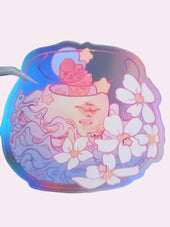 Triple Fish Bowls Die-Cut Sticker — approximately 3 inch clear waterproof vinyl sticker featuring an original dreamy recursive illustration of three fishbowls — one containing a goldfish, one enclosing a head, the head itself becoming a fishbowl — surrounded by white florals, part of the Signature Collection by indie artist Ailyse of Finding Wonderland