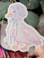 Close-up of Wander Goose sticker showing hand-drawn gingham pattern and ribbon detail