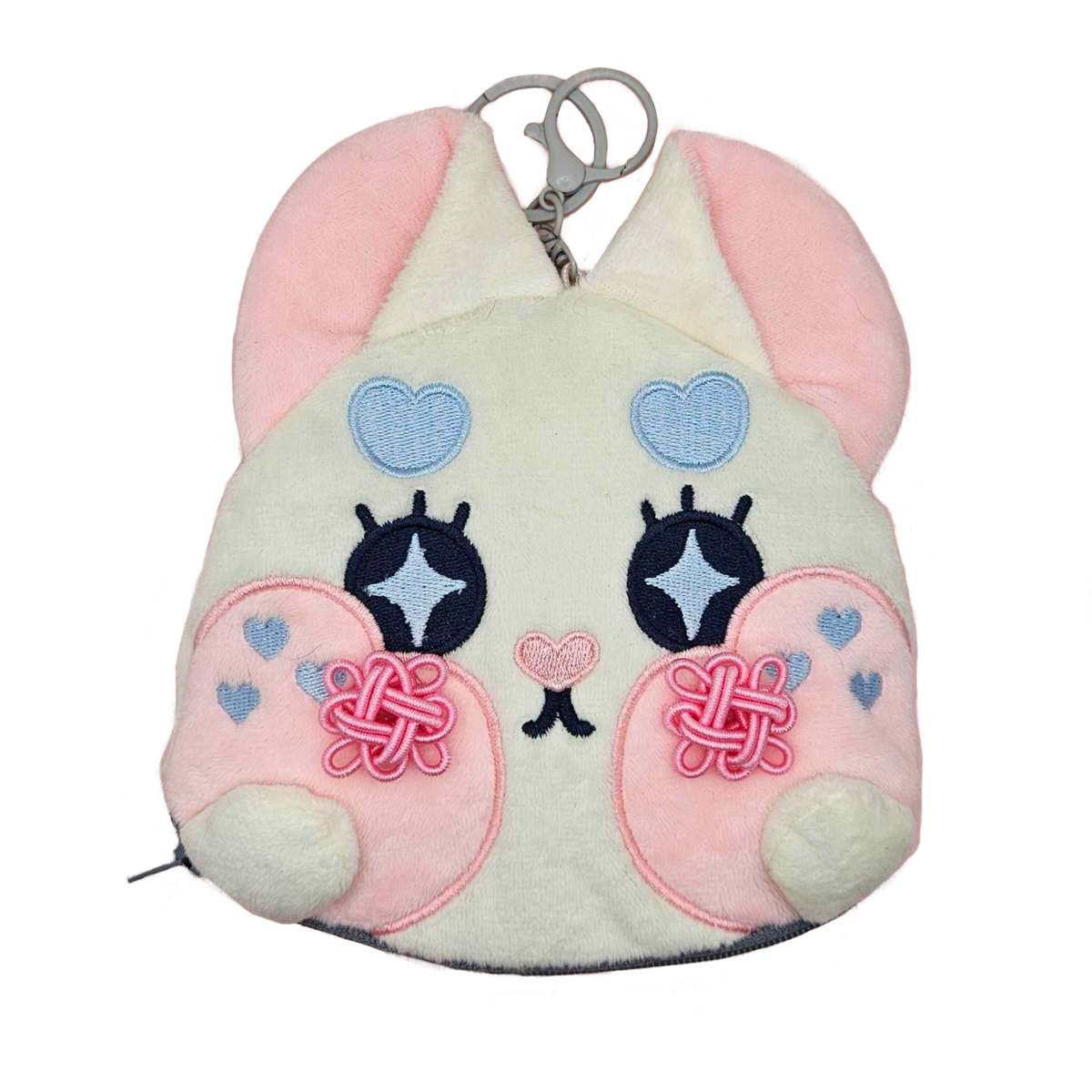 Double Lucky plush coin pouch from the Little Wonders collection by Finding Wonderland — a soft white bunny face plush pouch with embroidered sparkle eyes, pink knotted lucky charms on each cheek, blue heart details, and a tiny embroidered heart nose, limited run of 100, designed by indie artist Ailyse