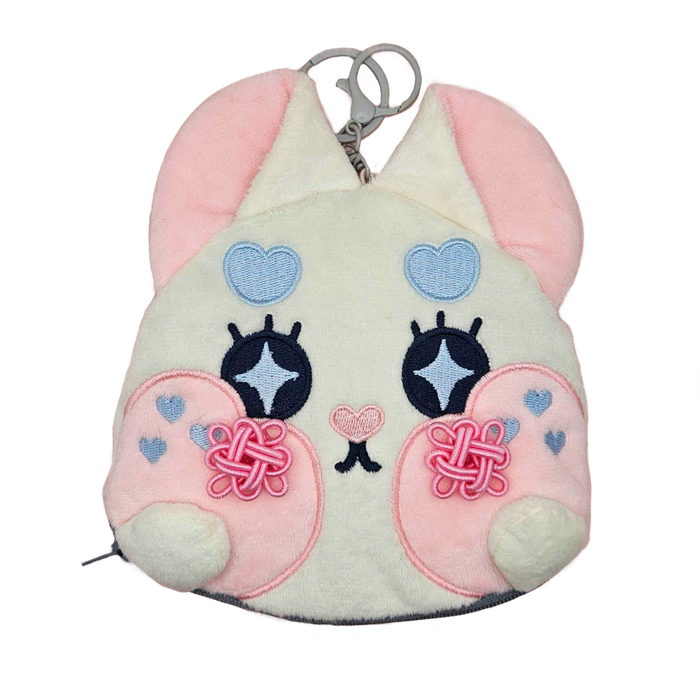 Double Lucky plush coin pouch from the Little Wonders collection by Finding Wonderland — a soft white bunny face plush pouch with embroidered sparkle eyes, pink knotted lucky charms on each cheek, blue heart details, and a tiny embroidered heart nose, limited run of 100, designed by indie artist Ailyse