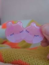 Close-up of Wander Bear hairclip showing glossy resin coating and hand-illustrated bear face detail