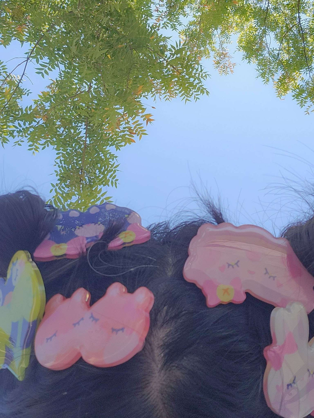 Hairclips worn in hair, shown outdoors alongside other Little Wonders hairclip designs