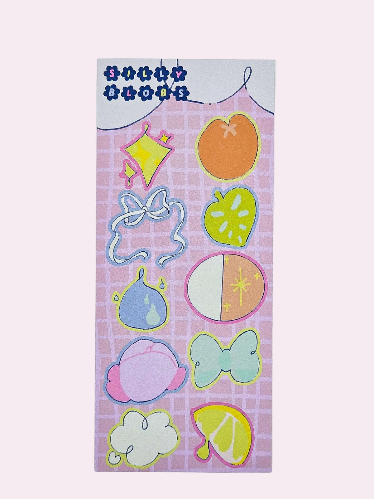 Silly Blobs pink variant sticker sheet featuring ten hand-drawn illustrated stickers including a diamond sparkle blob, peach blob, ribbon bow blob, green strawberry blob, fig blob, half circle blob, pink creature blob, teal bow blob, cloud blob, and lemon slice blob on a pink grid background by Ailyse of Finding Wonderland