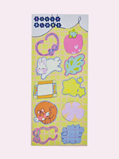 Silly Blobs yellow variant sticker sheet featuring ten hand-drawn illustrated stickers including a heart loop blob, strawberry blob, bunny blob, leaf blob, frame blob, flower blob, tiger cat blob, circle bloom blob, ribbon bow blob, and blue cloud blob on a yellow grid background by Ailyse of Finding Wonderland