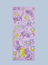 Until You Meet Me holographic sticker sheet featuring Funny Bunny the space cat drifting through stars in shades of lavender and green, Little Wonders collection by indie artist Ailyse of Finding Wonderland — 3 by 7 inch vinyl-like sticker sheet